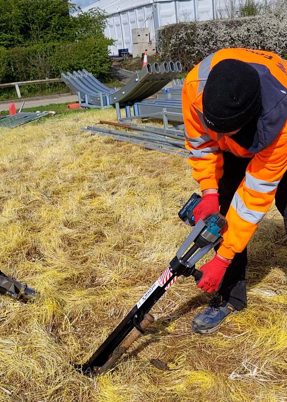 
Xtracto pulling marquee pin from the ground