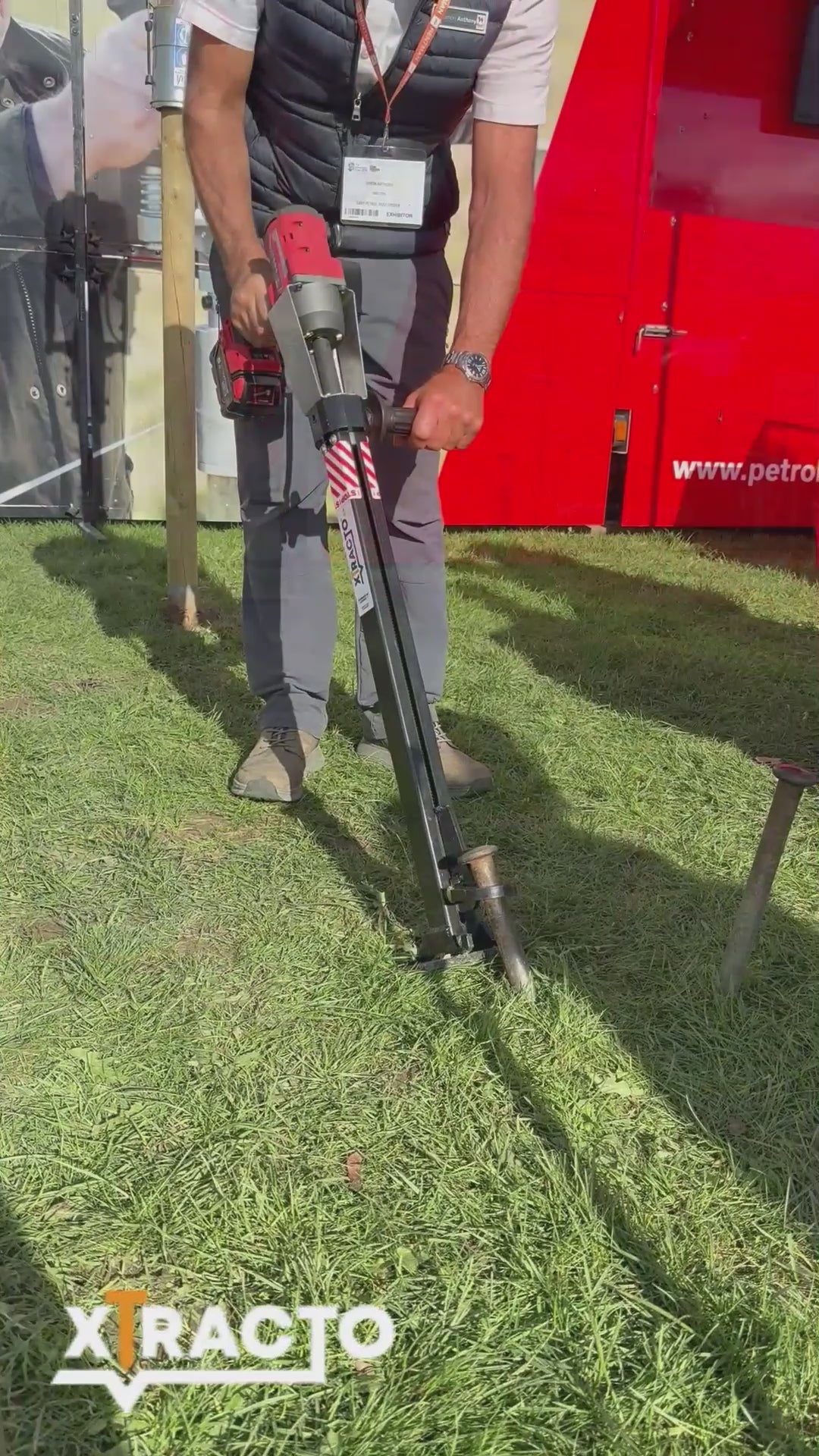 Xtracto removing various items from the ground; road pins, marquee pins, self-set tree saplings